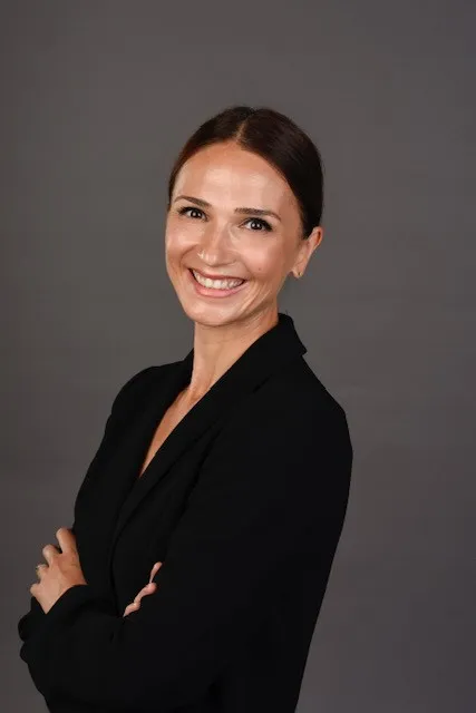 a woman in a black suit